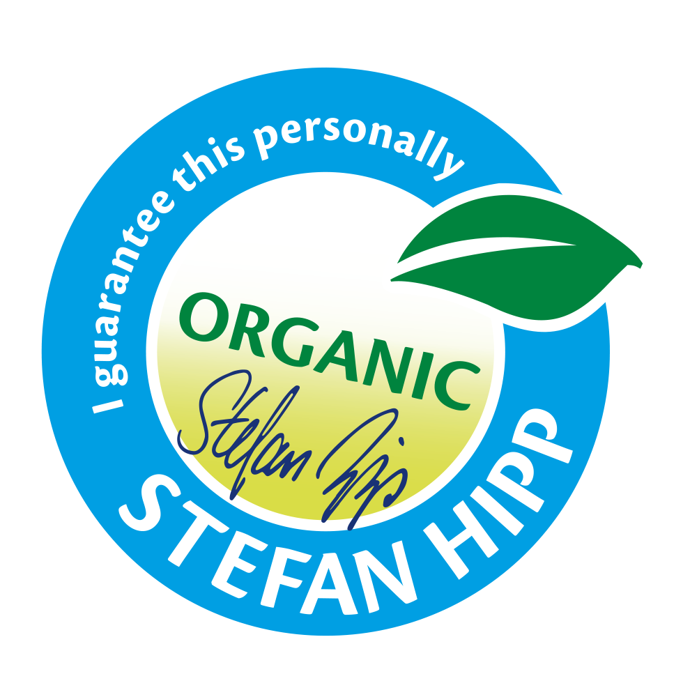 A circular badge with the word "ORGANIC" in the center, a green leaf on the top right, and the name "Stefan Hipp" written around the bottom.